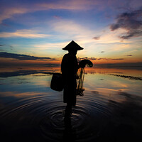 Buy canvas prints of Sunrise Balinese male net fishing Flores sea coastline  by Spotmatik 