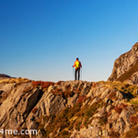 Buy canvas prints of Panoramic rugged terrain of Snowdonia with female hiker by Spotmatik 