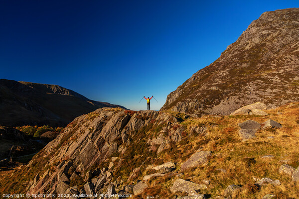 Scenic views across Snowdonia for outdoor female hiker Picture Board by Spotmatik 