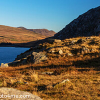 Buy canvas prints of Panoramic lake Snowdonia National Park with female hiker by Spotmatik 