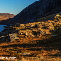Buy canvas prints of Panoramic lake among mountains with female hiker Snowdonia by Spotmatik 