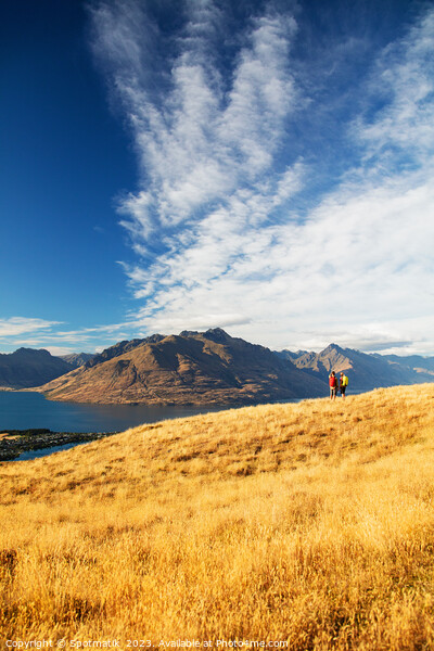 New Zealand trekking couple viewing Lake Wakatipu Otago Picture Board by Spotmatik 