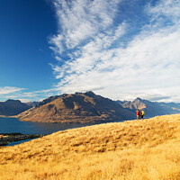 Buy canvas prints of New Zealand trekking couple viewing Lake Wakatipu Otago by Spotmatik 