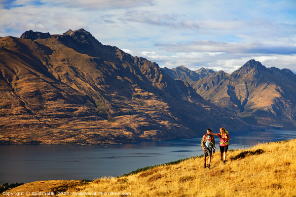 Hikers on trekking expedition enjoying view Lake Wakatipu  Picture Board by Spotmatik 