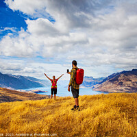 Buy canvas prints of Backpacking young couple taking smartphone picture Lake Wakatipu  by Spotmatik 
