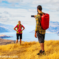 Buy canvas prints of Panorama of male taking smartphone travel photos of girlfriend by Spotmatik 