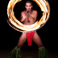 Buy canvas prints of Male Fire dancer illuminated spinning flaming torch Polynesia  by Spotmatik 