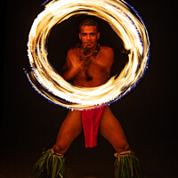 Buy canvas prints of Male Fire dancer with illuminated spinning flaming torch  by Spotmatik 