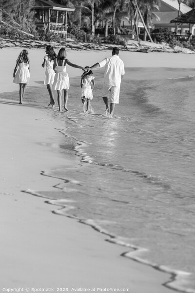 Young Caucasian girls parents on tropical island beach Picture Board by Spotmatik 