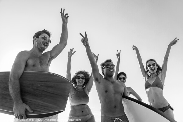 Friends enjoying carefree fun going bodyboarding on beach Picture Board by Spotmatik 