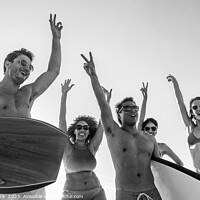 Buy canvas prints of Friends enjoying carefree fun going bodyboarding on beach by Spotmatik 