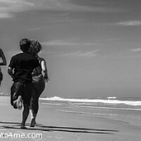 Buy canvas prints of Panoramic view of friends jogging together on beach by Spotmatik 