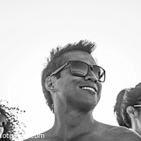 Buy canvas prints of Panoramic view of smiling young friends in sunglasses by Spotmatik 