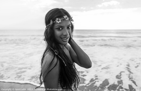 Indian woman by the ocean wearing flower headband Picture Board by Spotmatik 
