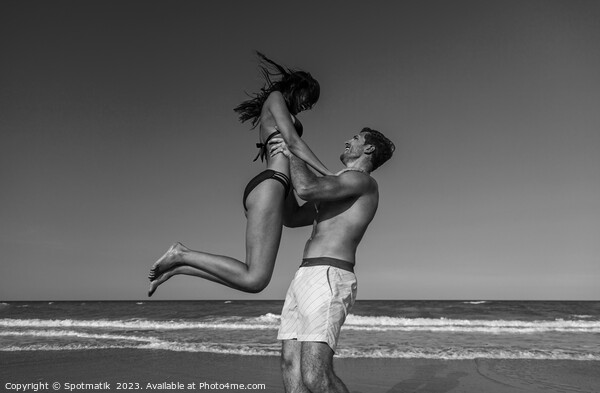 Male and female in swimwear enjoying Summer fun Picture Board by Spotmatik 