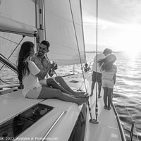 Buy canvas prints of Young family having fun on yacht at sunset by Spotmatik 