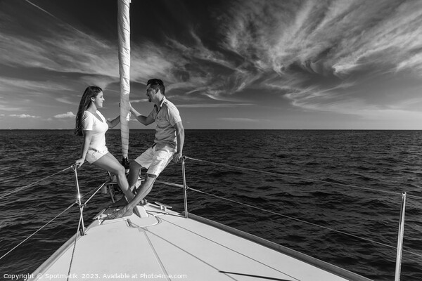 Hispanic couple enjoying luxury travel on private yacht Picture Board by Spotmatik 