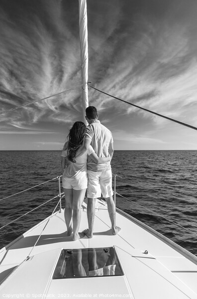 Loving young Latino couple standing on luxury yacht Picture Board by Spotmatik 