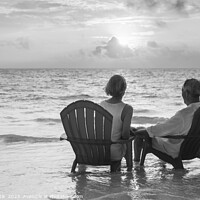 Buy canvas prints of Retired couple enjoying sunset view over ocean Bahamas by Spotmatik 