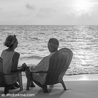Buy canvas prints of Panoramic ocean view with mature couple sitting together by Spotmatik 