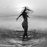 Buy canvas prints of Panoramic ocean sunset with dancing girl motion blur by Spotmatik 