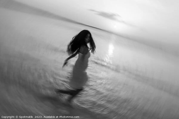 Motion blurred Asian girl dancing in ocean sunset Picture Board by Spotmatik 