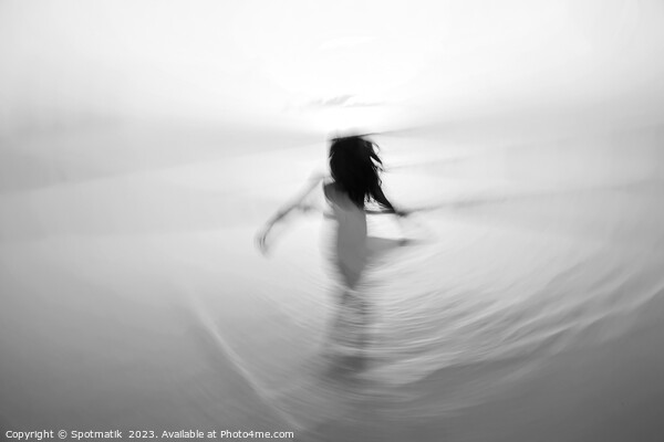 Motion blurred Asian girl dancing in ocean sunrise Picture Board by Spotmatik 