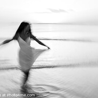Buy canvas prints of Panoramic motion blurred ocean sunset with dancing girl by Spotmatik 