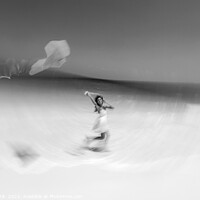 Buy canvas prints of Motion blurred young woman flying kite on beach by Spotmatik 
