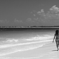 Buy canvas prints of Tropical beach resort with girls walking by ocean by Spotmatik 