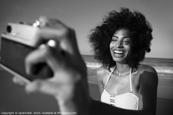 Laughing African American girl taking selfie on beach Picture Board by Spotmatik 