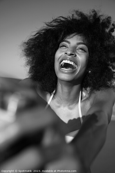 Laughing African American woman taking selfie on beach Picture Board by Spotmatik 
