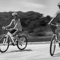 Buy canvas prints of Leisurely cycle ride for young African American couple by Spotmatik 