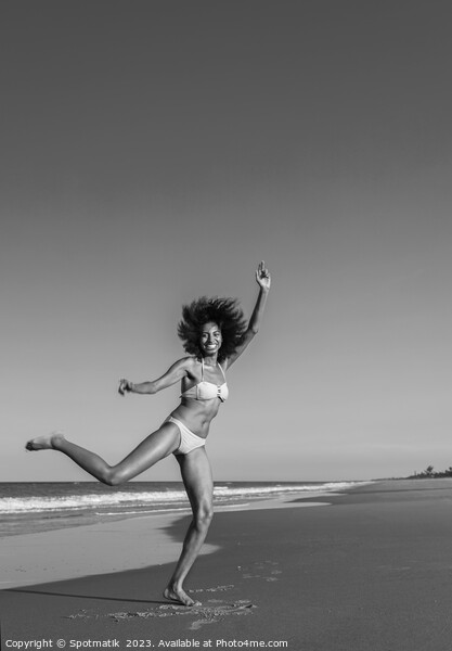 Playful young Afro American woman by the ocean Picture Board by Spotmatik 