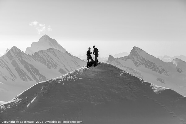 Aerial Switzerland two climbers on snow covered Peak Picture Board by Spotmatik 