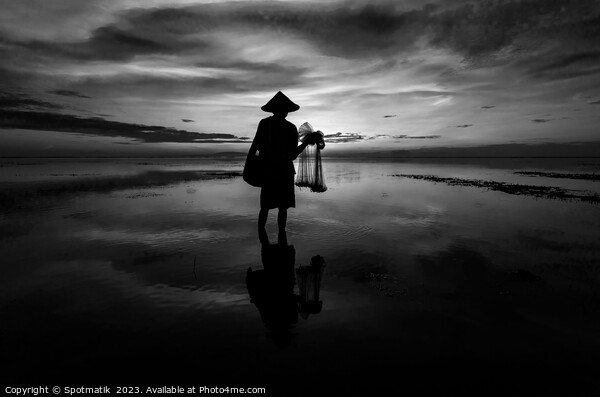 Silhouette Balinese male fishing Indonesian coastline at sunrise Picture Board by Spotmatik 