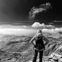 Buy canvas prints of Young female hiker relaxing on mountain summit Wales by Spotmatik 