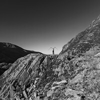 Buy canvas prints of Happy female backpacker on rugged mountain peak Snowdonia by Spotmatik 