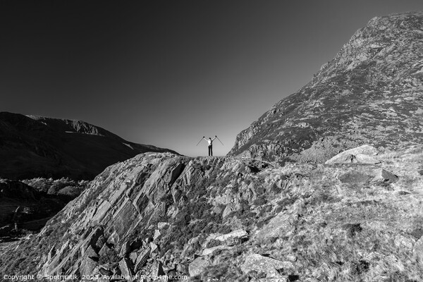 Scenic views across Snowdonia for happy female hiker Picture Board by Spotmatik 