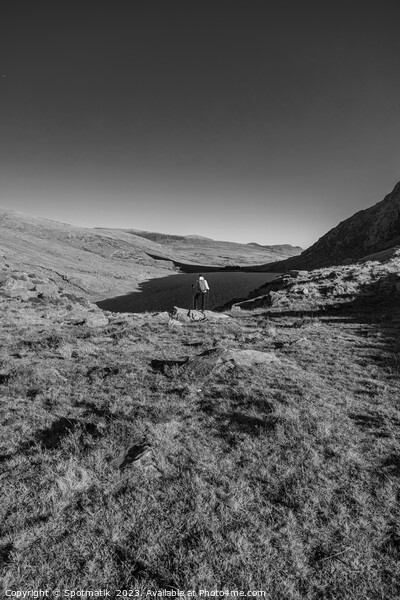 Lake in rural landscape with female backpacker Snowdonia Picture Board by Spotmatik 