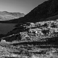 Buy canvas prints of Panoramic lake among mountains with female hiker Snowdonia by Spotmatik 