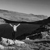 Buy canvas prints of Panoramic female backpacker enjoying scenic lake view Snowdonia by Spotmatik 