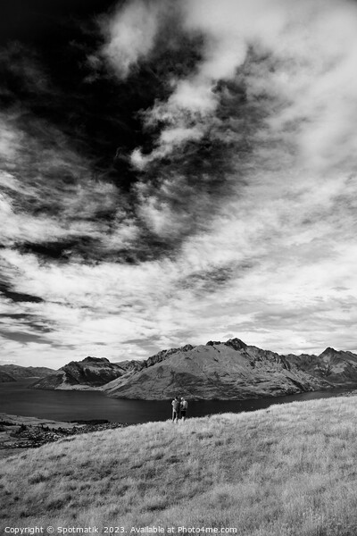 Male female hikers viewing Lake Wakatipu New Zealand  Picture Board by Spotmatik 