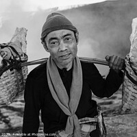 Buy canvas prints of Indonesian worker manually carrying sulphur blocks from volcano  by Spotmatik 