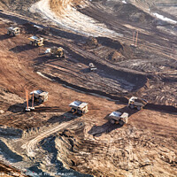 Buy canvas prints of Aerial view giant dump trucks carrying mined Oilsand  by Spotmatik 