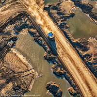 Buy canvas prints of Aerial giant dump trucks Athabasca Tar sand site  by Spotmatik 