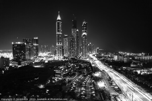 Night Dubai illuminated view of modern city Skyscrapers Picture Board by Spotmatik 