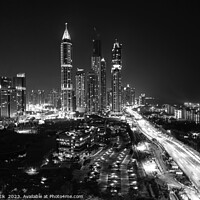 Buy canvas prints of Night Dubai illuminated view of modern city Skyscrapers by Spotmatik 