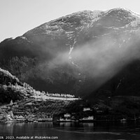 Buy canvas prints of Norwegian sunlight beaming though light mist glacial fjord  by Spotmatik 