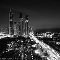 Buy canvas prints of Dubai dusk illuminated view Sheikh Zayed city skyscrapers  by Spotmatik 